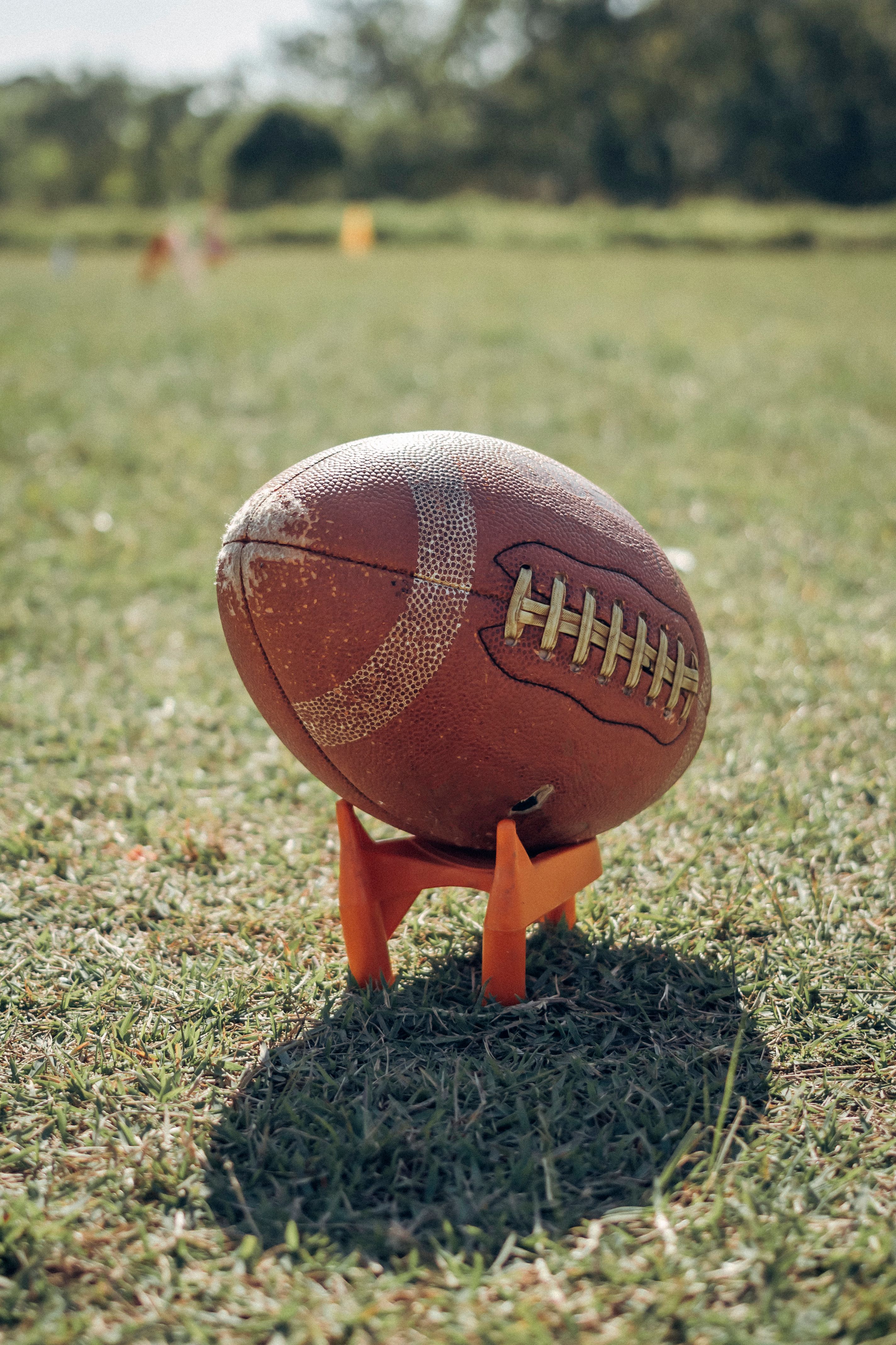 Football positioned on a kicking tee